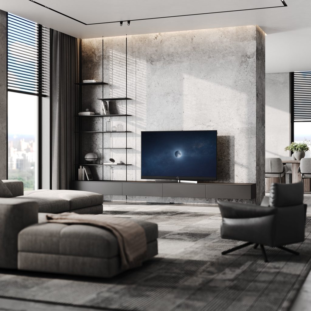LOEWE Stellar Black Lava mit Mondmotiv auf dem Bildschirm in einem modernem Wohnzimmer